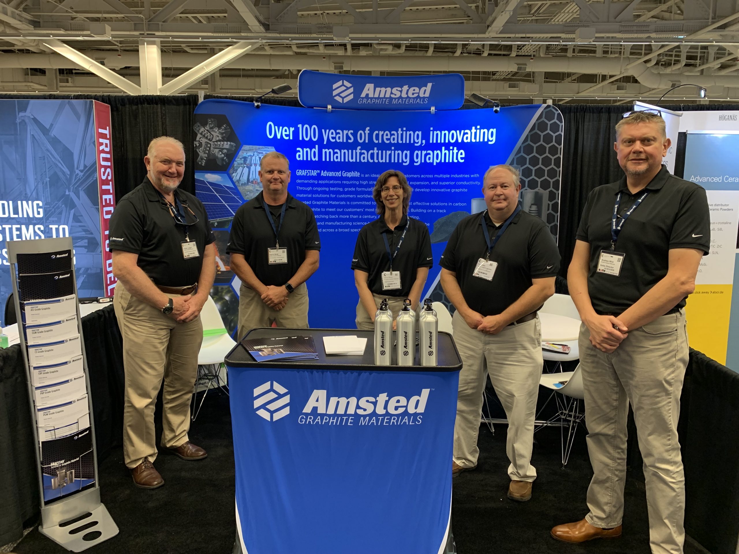 The Amsted Graphite Materials team poses at their booth at Ceramics Expo